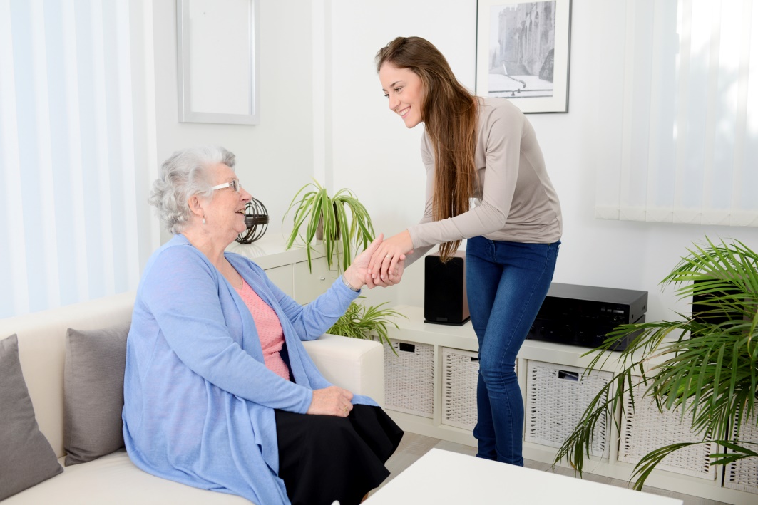 young lady helping senior lady stand, Independence for Seniors