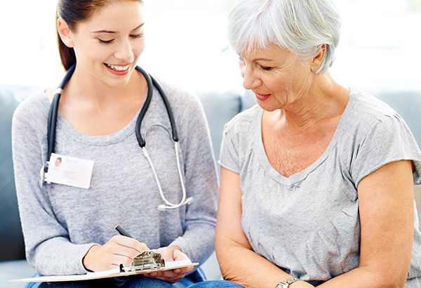 Caregiver talking with senior